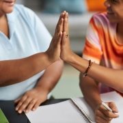 close up of mature tutor giving high five to teena 2025 03 07 12 53 26 utc scaled 1